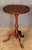 A fine English wine or cocktail table of mahogany from the Edwardian era, featuring a raised scalloped edge (or pie-crust)...