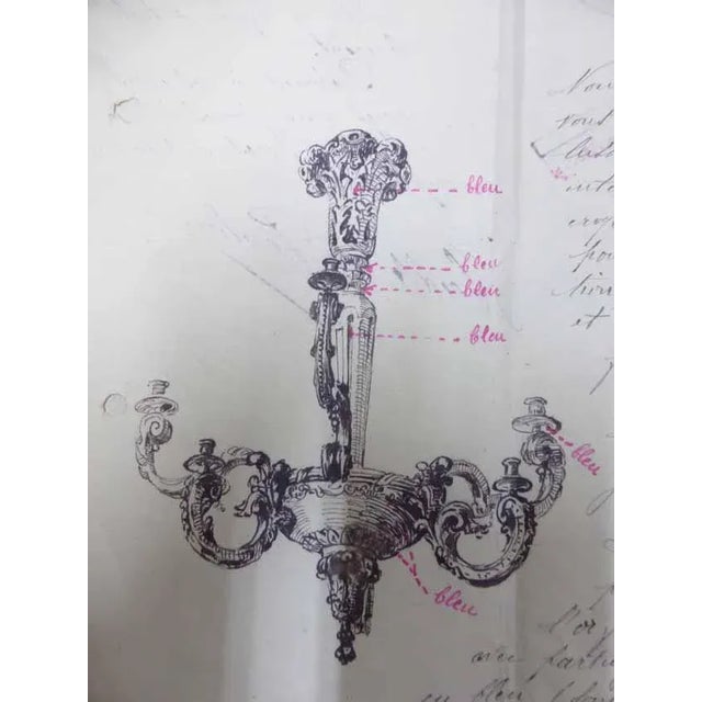 Large chandelier in lacquered wood with a golden patina. It is composed of 6 branches (3 large and 3 medium) it is...