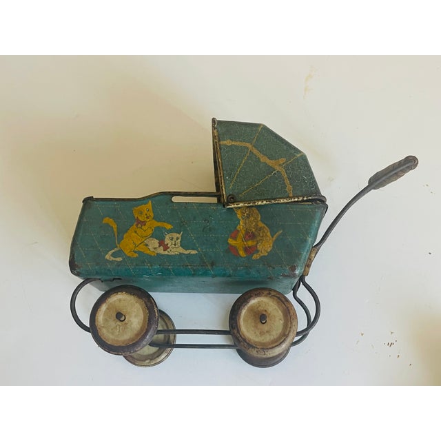 Antique collectible Marklin toy doll carriage with porcelain baby doll in original clothing and crochet cape. Great find...