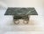Decorative and elegant antique table. Beautiful green and white marble top and lower shelf. Solid brass base.