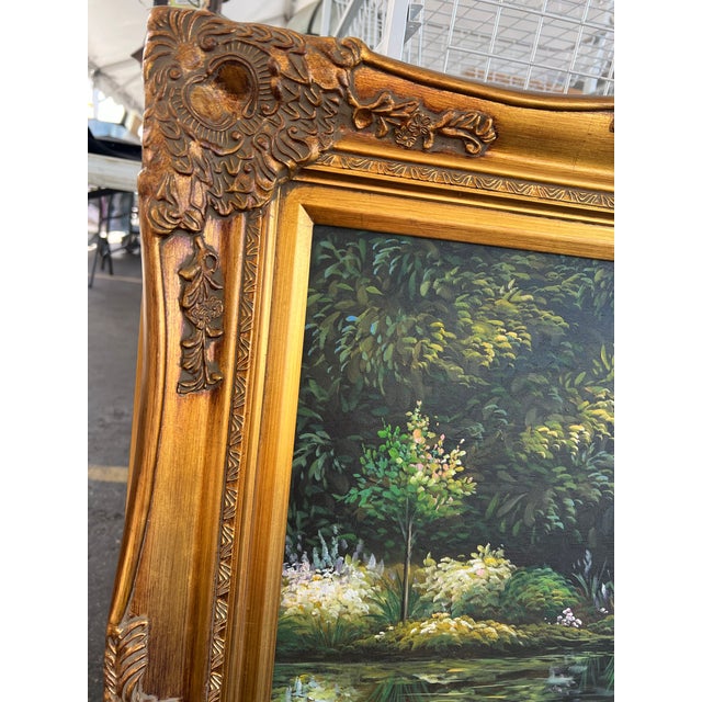 This item is a decorative framed oil painting featuring a water lily pond scene, styled after Claude Monet's...