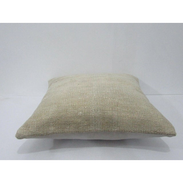 Decorative pillow cover made from a vintage Turkish handknotted rug. Backed with good quality cotton fabric. Pillow...