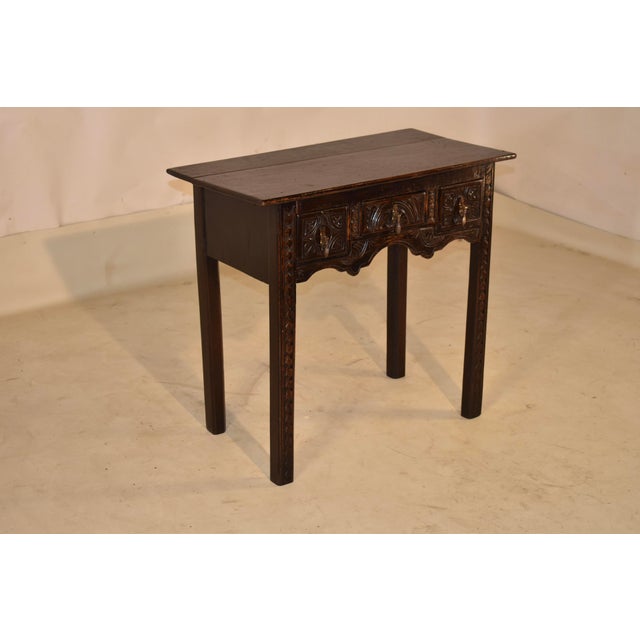 PERIOD 18th century Jacobean lowboy/side table. The top is nicely grained and follows down to simple sides and the front...