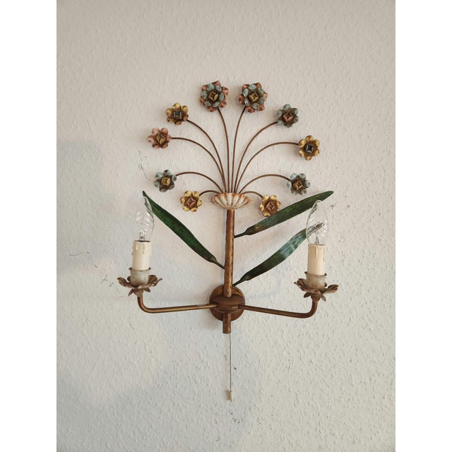This exceptionally rare, one-of-a-kind vintage wall lamp captivates with its artistic, floral design and is a wonderful...