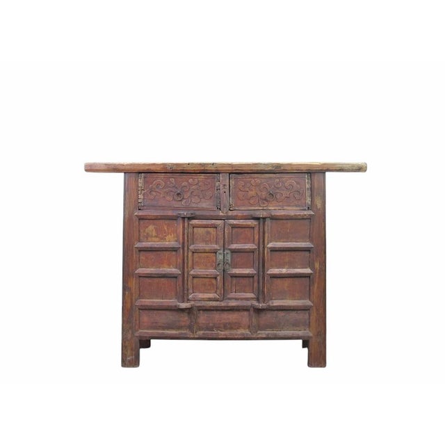 Dating to 1806, this antique cabinet sideboard is made from solid elm wood, showcasing a hand-carved facade with deep...