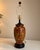 Beautiful vintage Italian-style ceramic table lamp featuring a rich oxblood red finish with elegant gold Florentine-...
