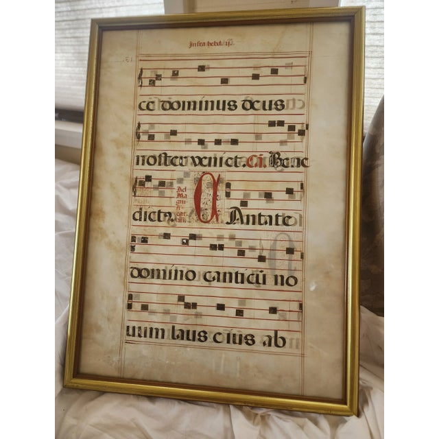 Beautiful early hand written church music on vellum framed so you can see the back ...clear glass on each side.