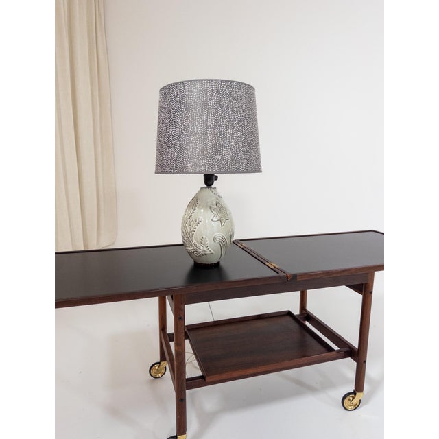 This sculptural ceramic table lamp was designed by Anna-Lisa Thomson (1905–1952), one of Sweden’s most important mid-...