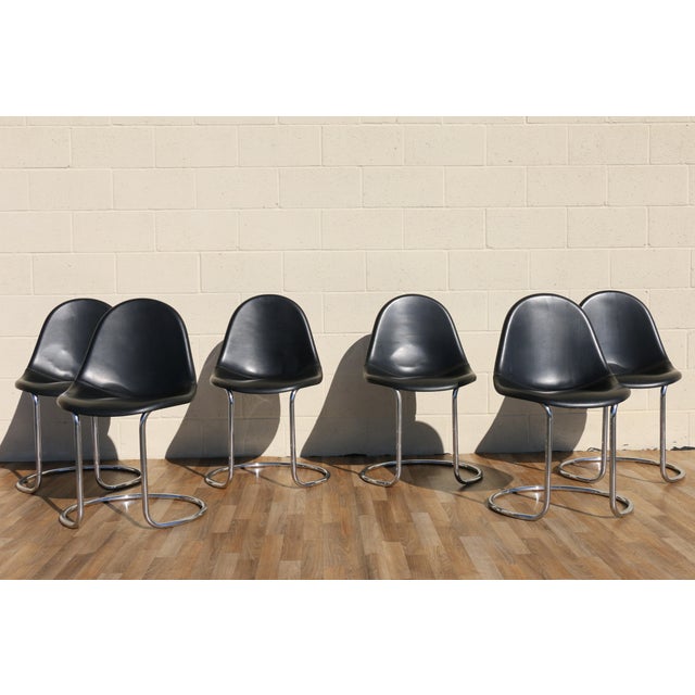 An iconic set of six “Maia” dining chairs designed by Giotto Stoppino for Bernini, Italy, in the 1960s. These chairs are a...