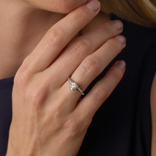 This elegant Mid Century engagement ring centers on a 1.01 carat old mine cut diamond, certified by GIA #6237903941,...