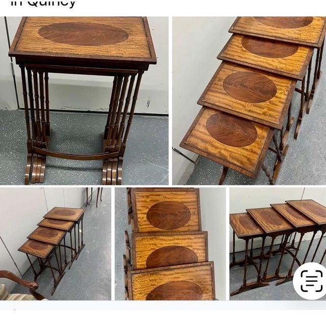 Antique mahogany nesting tables with flame veneer and oval inlay.