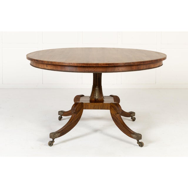 19th century english regency rosewood centre table an english regency rosewood and simulated rosewood centre table, circa...