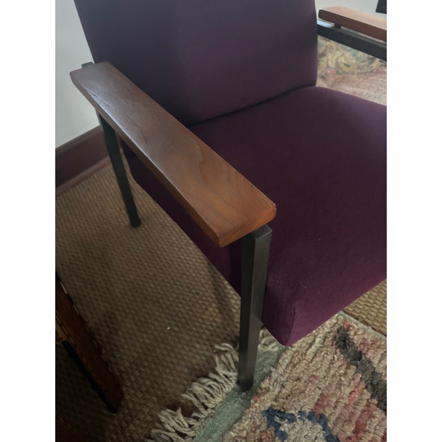 Super sophisticated midcentury modern imported Vermund Larsen “Cosy” Danish armchair having black metal base, walnut...