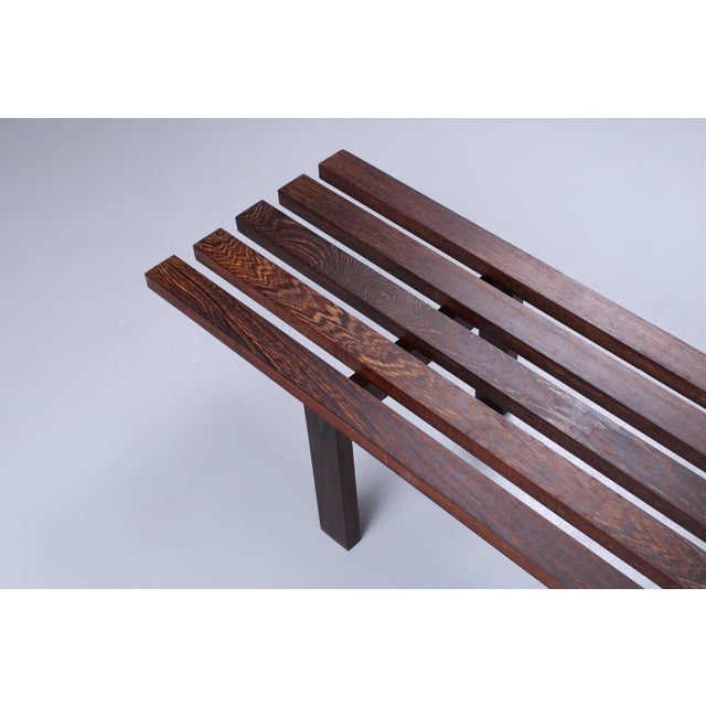 Solid wenge slatted bench, dating from the 1960s. Closely resembles the iconic Martin Visser BZ slatted bench for...