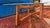 Stunning example of Mid Century Modern design and innovation. This oval, glass top table features a refinished, walnut...