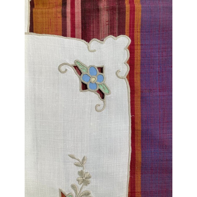 A set of ivory linen placemats with pastel floral hand embroidery. Starched pressed and ready for your holiday table.