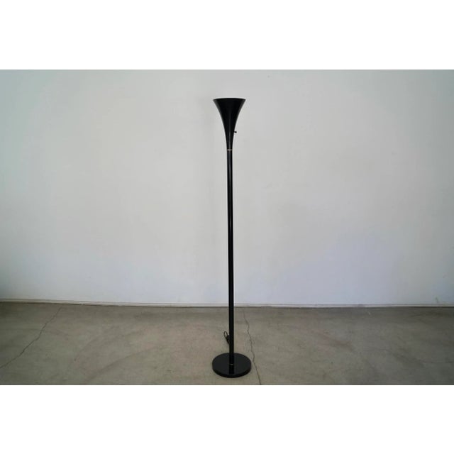 Vintage Mid-century Modern tulip floor lamp for sale. In the manner of Laurel Lighting, and is in black with brass...
