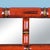 A faux bamboo mirror in red and gold with a Greek key border — chinoiserie and classical motifs in one glamorous frame....