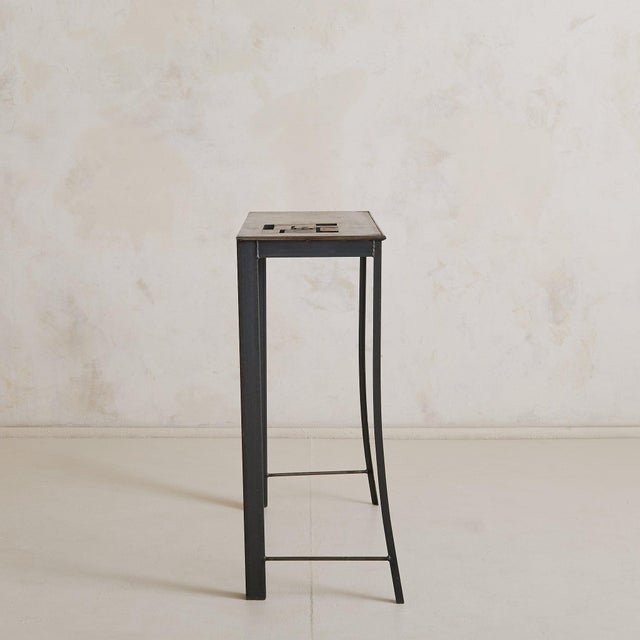 Crafted in mid-century France, this steel console table features a unique central inlay of geometric metal plates,...