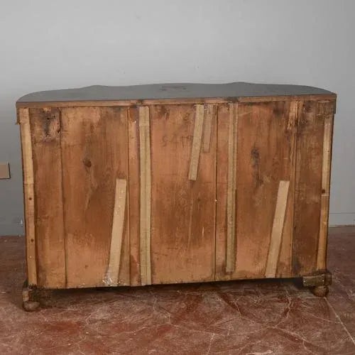 This elegant vintage sideboard represents a refined example of classic cabinetmaking, characterized by flowing lines and a...