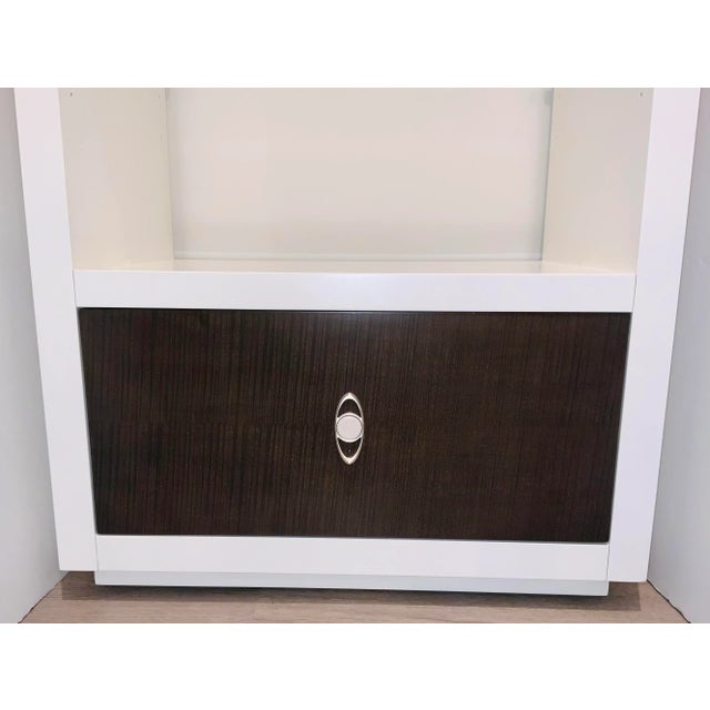 Original Retail $2806, stylish Caracole Modern White Stacked Up Etagere, one brown door with silver finished hardware,...