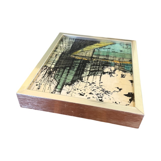 A striking original Brutalist architectural cityscape by Enzo Linca, presented in its original brushed aluminum gallery...
