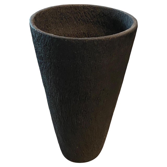 Charred coconut wood container that is both usable and sculptural. A graduation from the bottom to the top and charred...