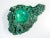Rough malachite cluster sculpture, with central recess carved and polished material rough malachite, with central hollow...