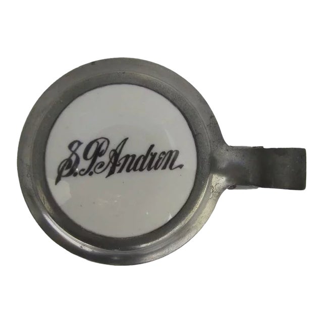 German glass stein with enamel lid. Paneled glass sides with geometric motif. 7 1/4" tall. Shipping quote is for the 48...