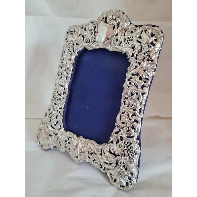 A fine antique English photograph frame by James Deakin & Sons, crafted with a solid sterling silver mount and hallmarked...