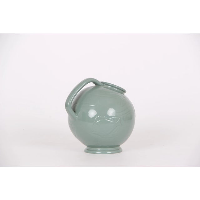 - Ceramic jug by Ipsens Enke in Denmark circa 1930 - Mermaid decoration - Green glaze This piece has an attribution mark,...