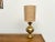 Maison Lecan presents this elegant vintage brass table lamp, made in the 1960s and 1970s. Its curved base, with the...