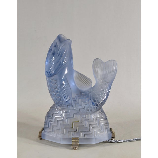 Pierre d'Avesn for Lorrain & Charles Ranc A French art deco night lamp in blue toned pressed glass made circa 1925-1935....