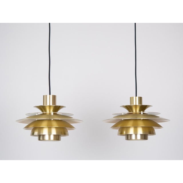 This lamp was designed by Danish designer Kurt Wiborg and manufactured by Jeka. The lamp's form is based on the principle...