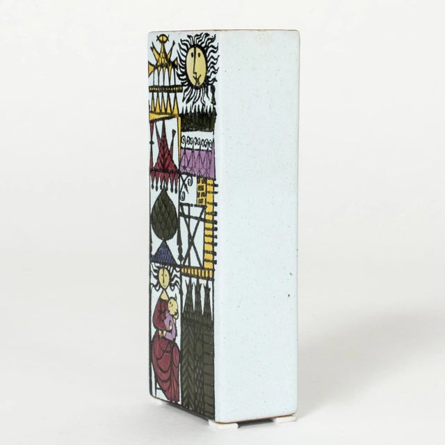 Faience “Karneval” vase by Stig Lindberg, in a strict block shape. Beautiful, playful motif of a fantasy town with graphic...