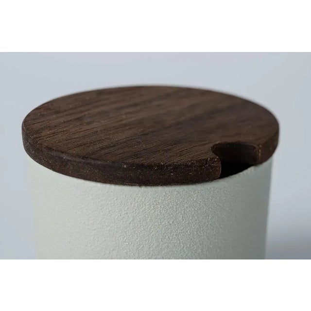 Set consisting of two coffee cups, sugar bowls and teaspoon. The forms are clean, simple but elegant at the same time and...