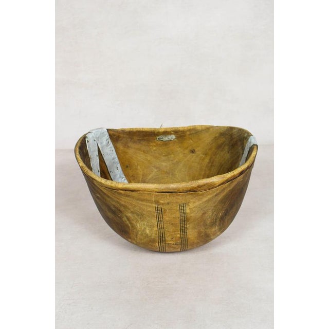 This hand-carved wooden bowl is made by the Turkana, a nomadic community in north-west Kenya prized for their woodcarving...