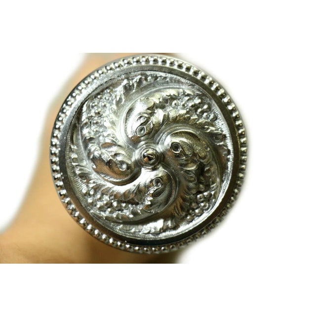 Solid brass swirl entry door knob set with a nickel finish. The manufacturer is unknown. Priced as a pair of knobs with...