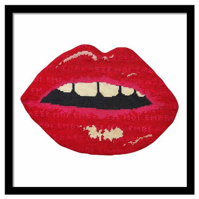 not needlepoint Embrasse Moi is French for "kiss me." If you look closely you'll see this phrase within the pout. x x...