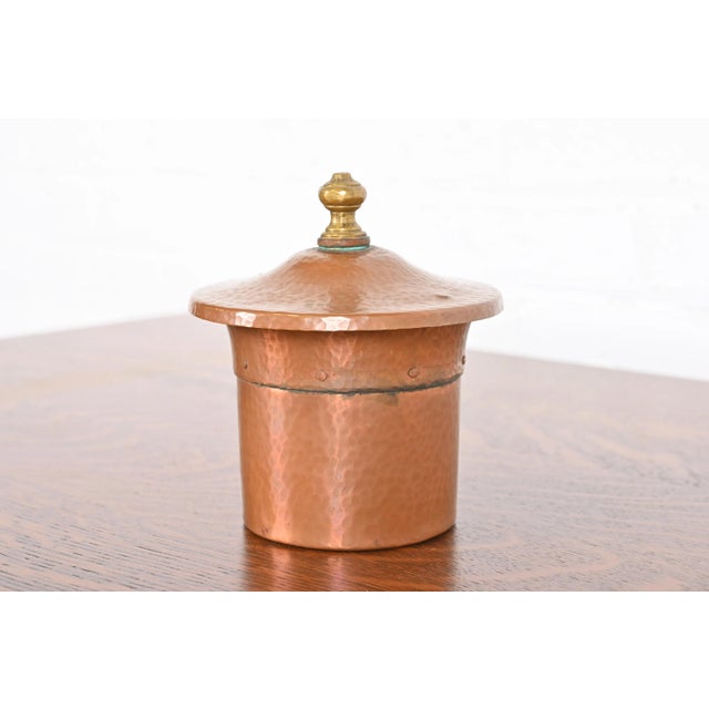 A gorgeous Arts & Crafts period hammered copper and brass humidor By Benedict Studios USA, Circa 1910 Measures: 5"W x 5"D...