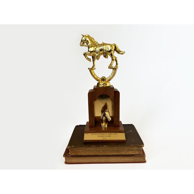 Equestrian vibes abound with this vintage horse show trophy circa 1972. The trophy features a brass horse top, wood base...