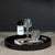 A striking blend of elegance and functionality, this round lacquered MDF tray features a high-gloss black finish that adds...