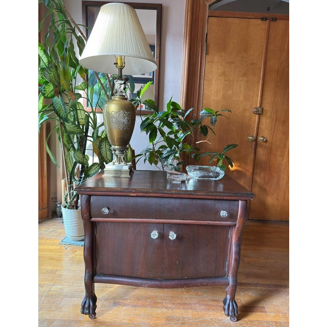 1950s vintage table lamp in a Neoclassical style associated with French Empire and Hollywood Regency interiors. The lamp...