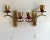 Stylish Paired wall sconces in beautiful gilt brass and ruby acrylic glass decorative elements from the German...