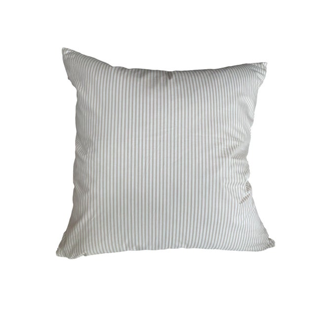 This pillow features a vibrant floral pattern on the front, showcasing bold blooms in rich colors like purple, blue,...