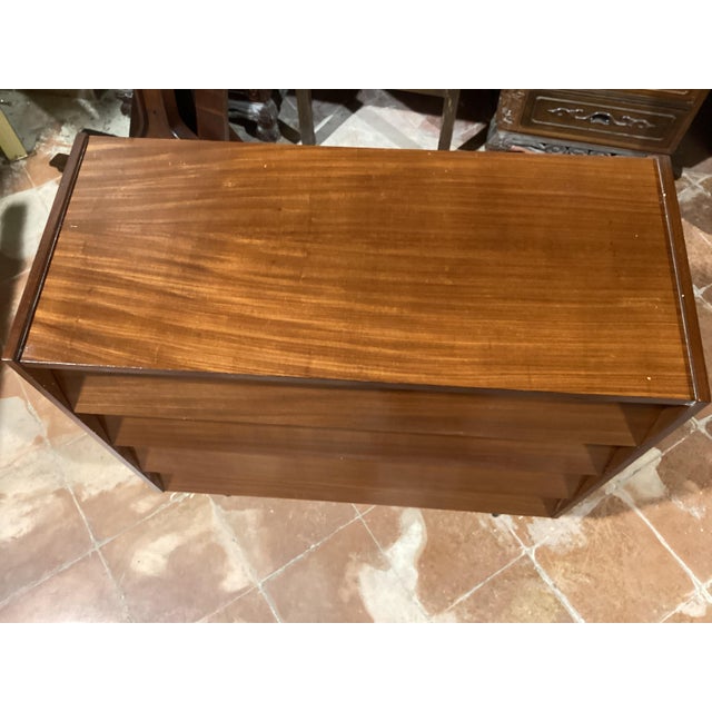 The drawers are hinged and inside there are rods specifically for shoes This piece is attributed to the mentioned...