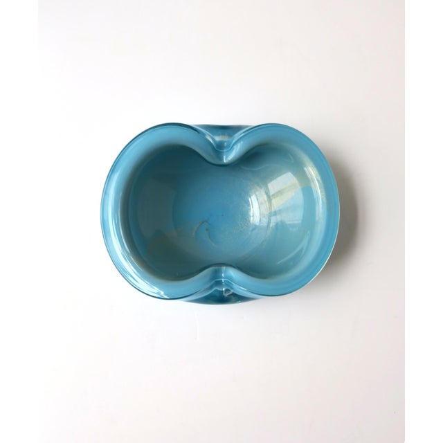 A beautiful and substantial Italian Murano sky-blue and gold art glass bowl, attributed to designer Alfredo Barbini,...