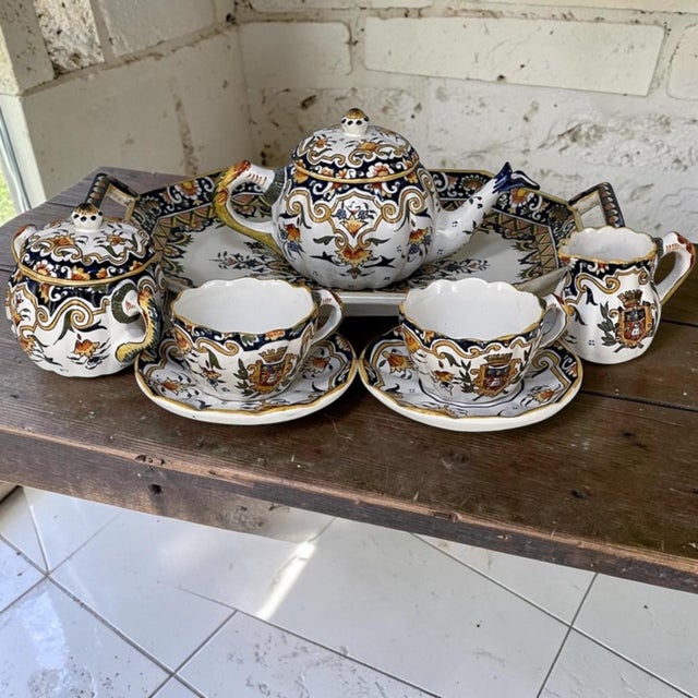 19th Century French Faience 8 piece Hand-Painted Tea Service represents the remarkably unique and definitively French...