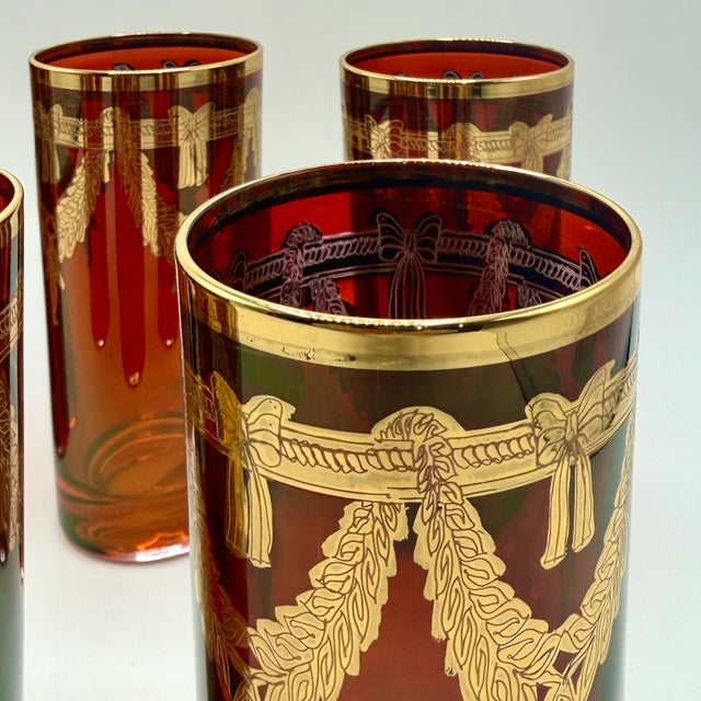 A set of six vintage italian highball glasses by interglass, each handmade in italy and richly decorated with genuine 24k...