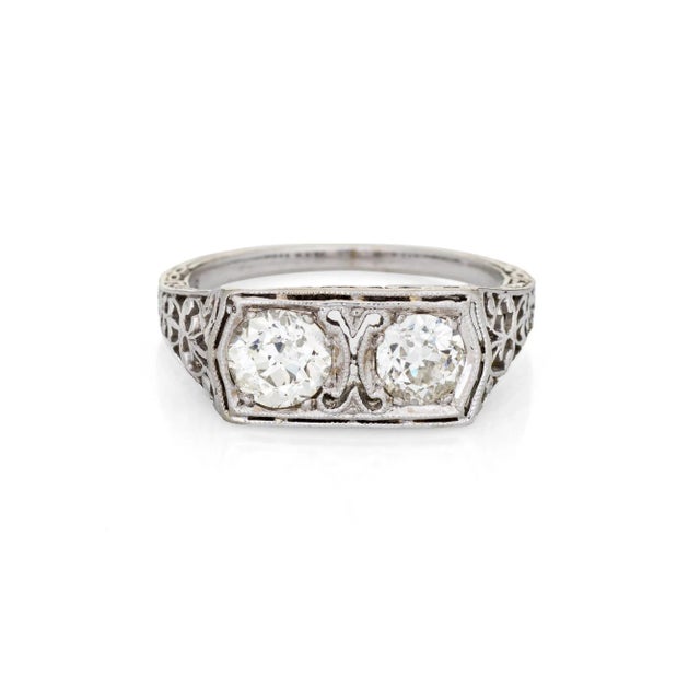 Finely detailed vintage Art Deco double diamond ring (circa 1920s to 1930s) crafted in 18k white gold. Two old European...
